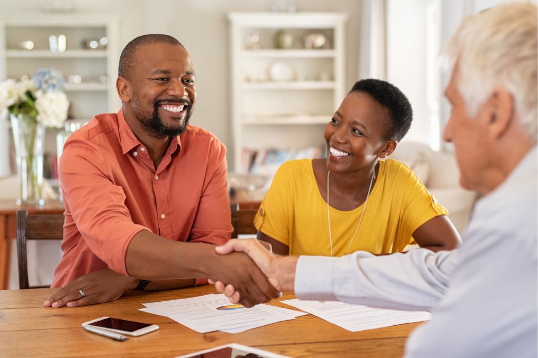 Man shaking hands with insurance agent 