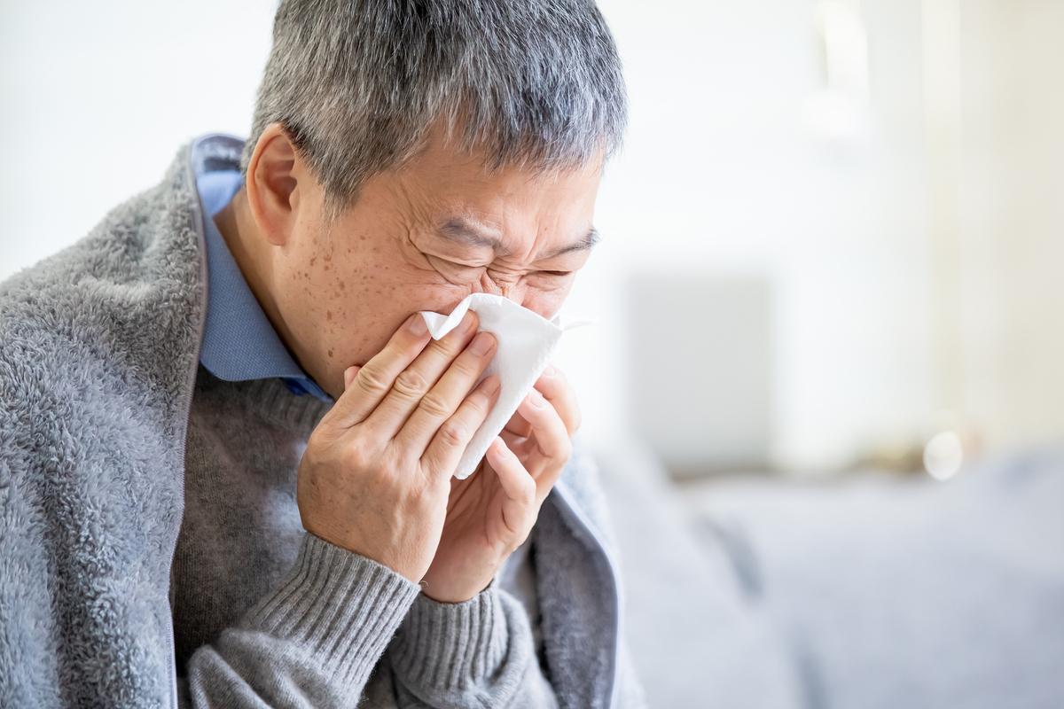 Old asian man get a cold 
