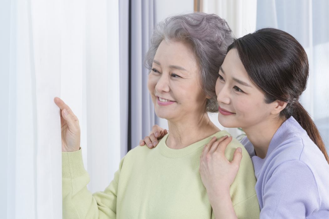 Happy smiling Asian old mothe