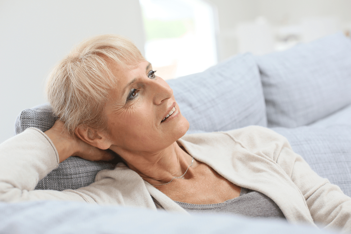 Senior woman relaxing on sofa