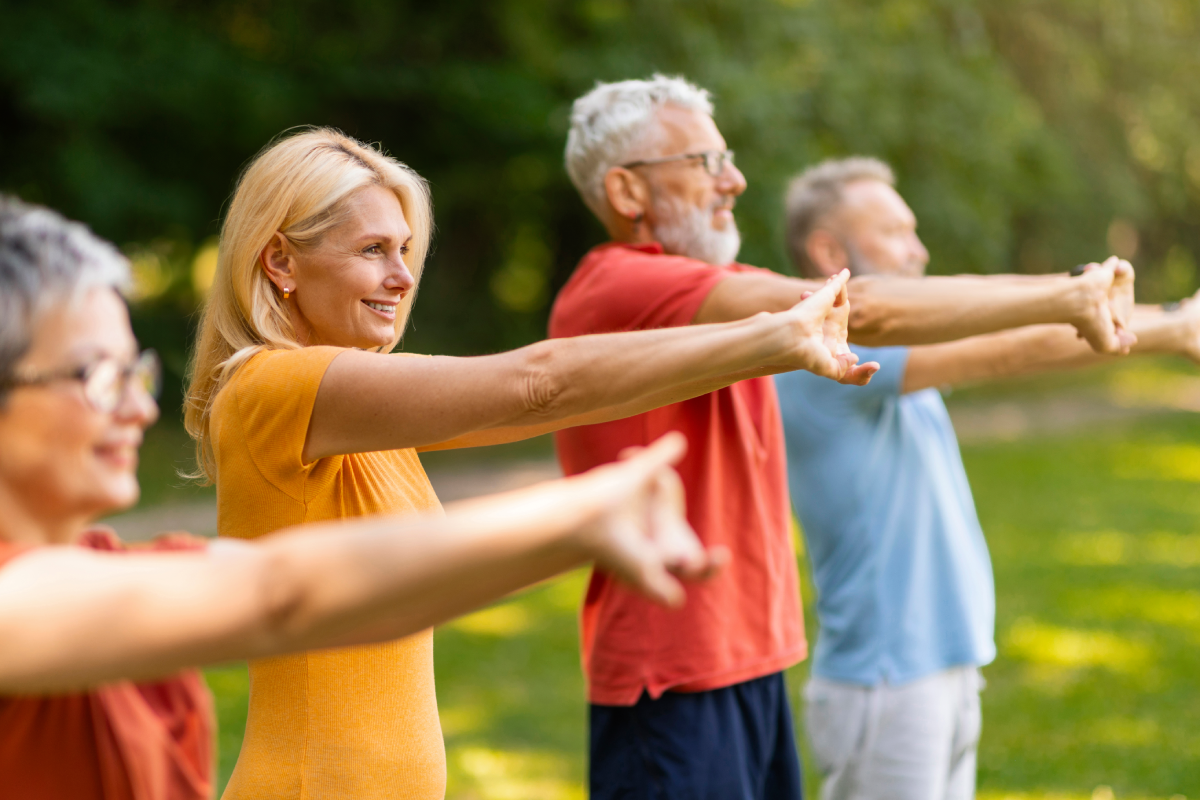 Group of happy seniors doing stretching exercises